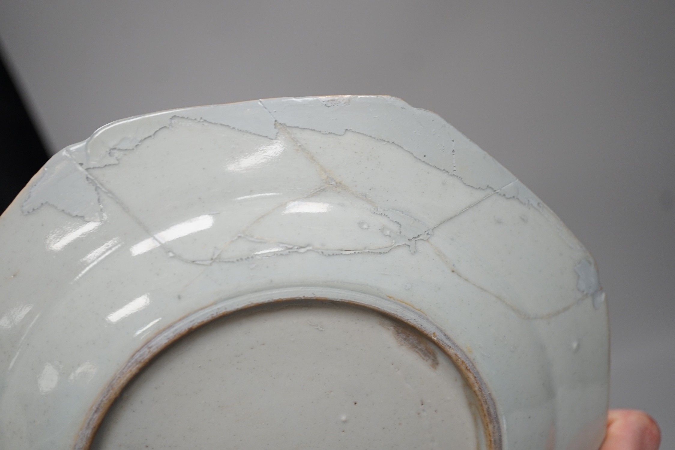 A Chinese figure of blanc de chine, a dragon tea bowl, a saucer, a large tankard, and another Chinese dish, tallest 23cm